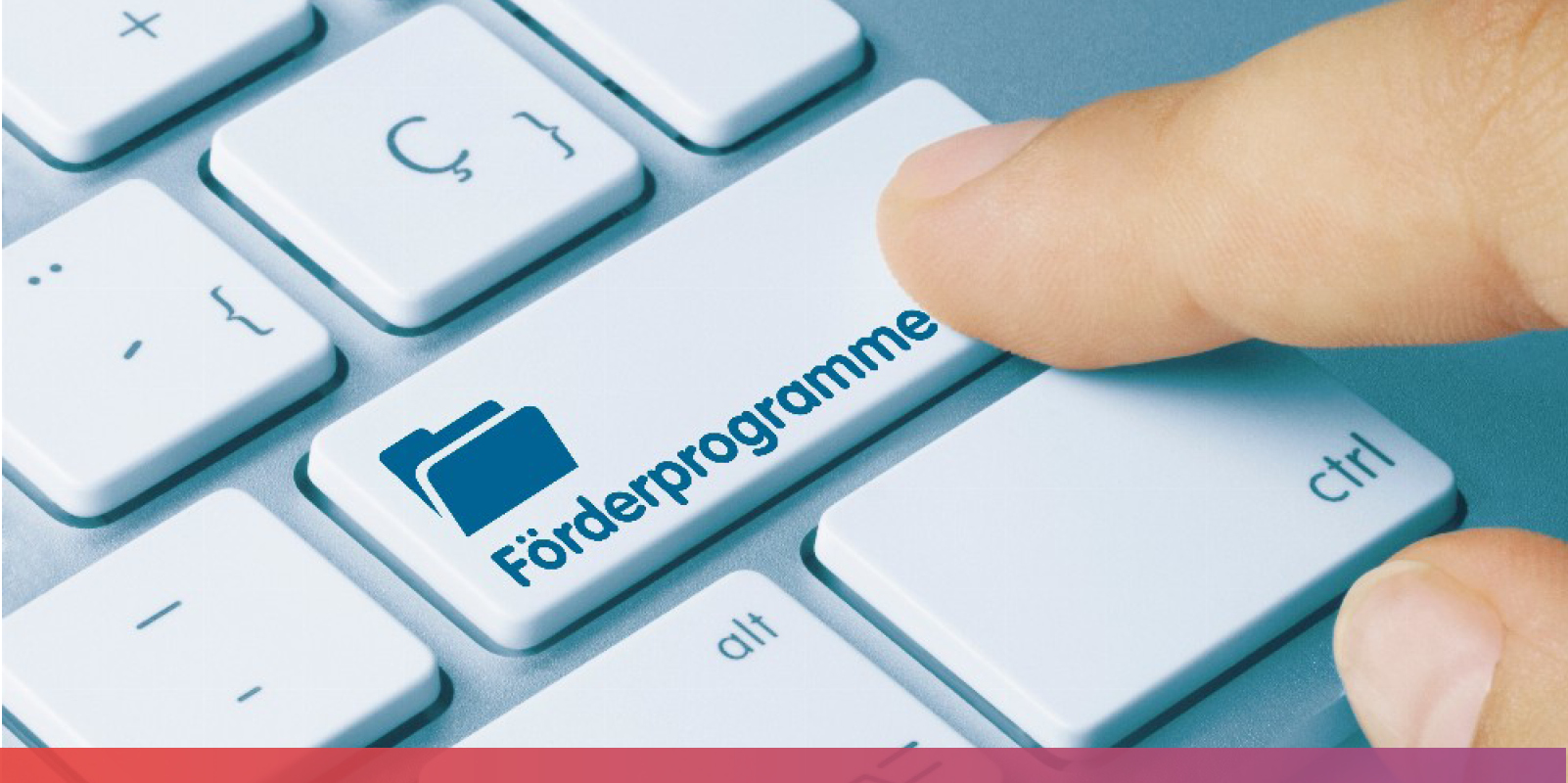 Bild: Eine Tastatur in Nahaufnahme. Auf der SHift-Taste steht das Wort 'Förderprogramme'.